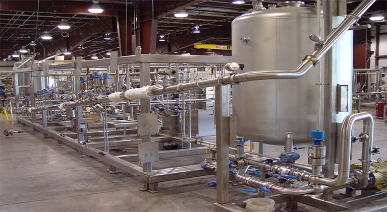 Customized skidded modular process system for pharmaceutical manufacturing line